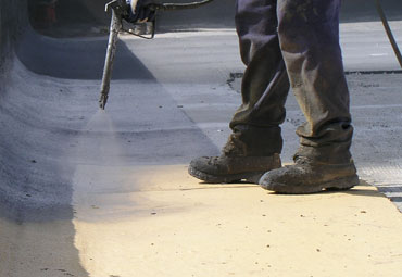 Coating systems over San Bernardino spray foam roof systems
